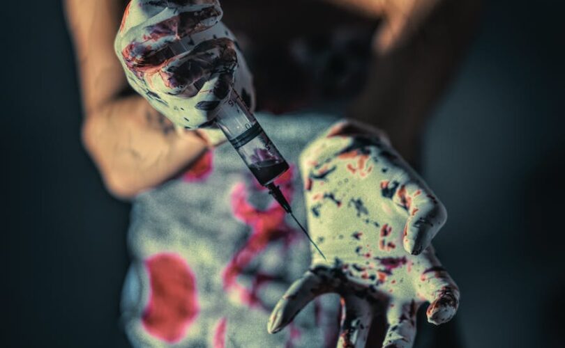 close up photo of person with paint on her hands